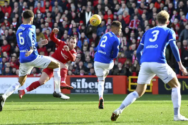 Niall McGinn swipes a shot high over the crossbar