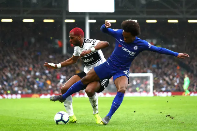 Ryan Babel of Fulham and Willian of Chelsea