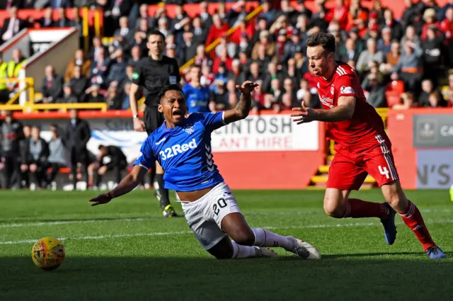 Alfredo Morelos takes a tumble in the Aberdeen penalty box