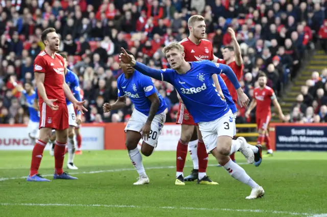 Joe Worrall celebrates his equaliser for Rangers at Pittodrie