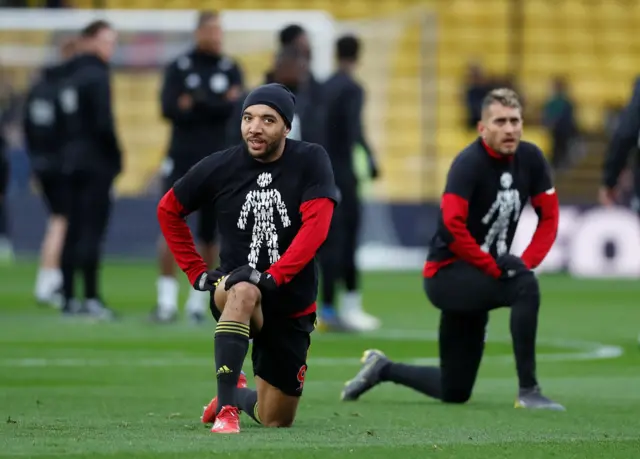 Troy Deeney warms-up