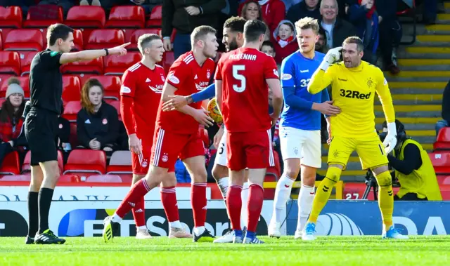 Allan McGregor disputes the corner kick awarded by Kevin Clancy