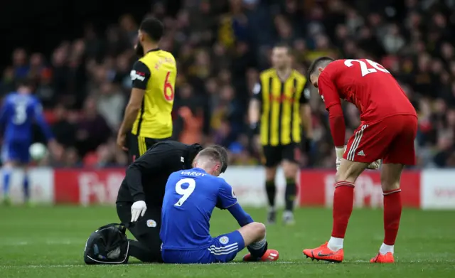 Jamie Vardy is treated for an injury prior to being substituted