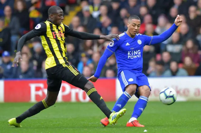 French midfielder Abdoulaye Doucoure (L) vies with Leicester City's Belgian midfielder Youri Tielemans