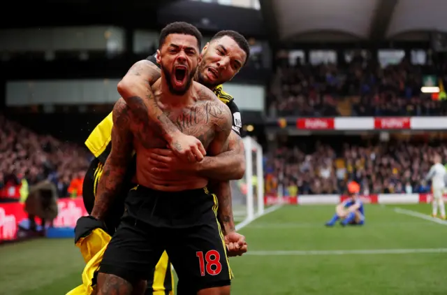 Andre Gray of Watford celebrates scoring the winner against Leicester