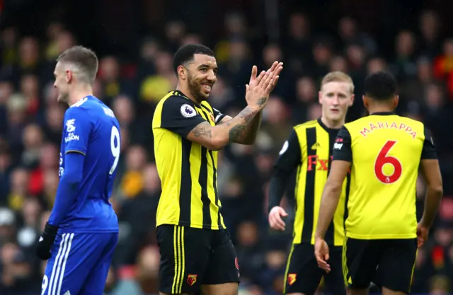 Troy Deeney of Watford gestures towards the Leicester City fans
