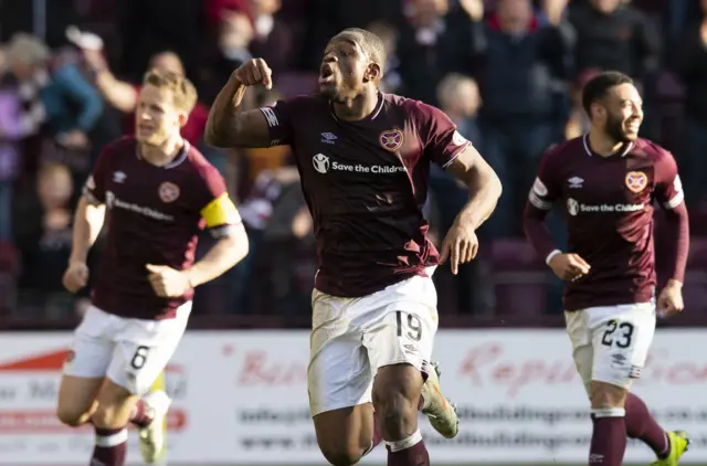 Uche Ikpeazu celebrates his match-winning goal for Hearts