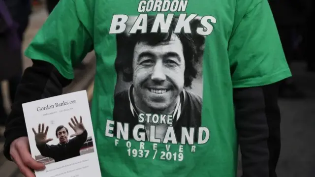 A person holds an order of service for former Stoke City and England goalkeeping legend Gordon Banks at the bet365 Stadium