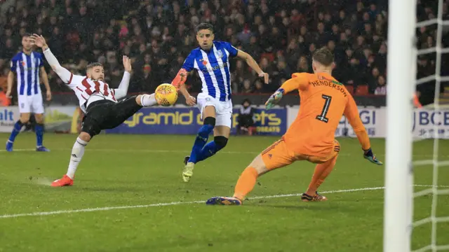 Players challenge for the ball