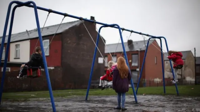 Children playing on swings