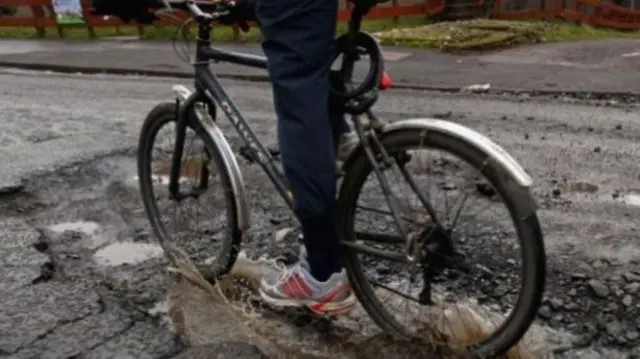 POTHOLE CYCLIST