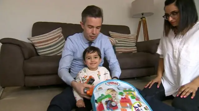 Aadi Wilson with his parents parents Mark and Panna