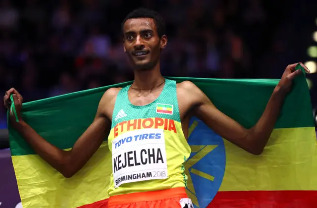 Yomif Kejelcha pictured holding the Ethiopian flag.