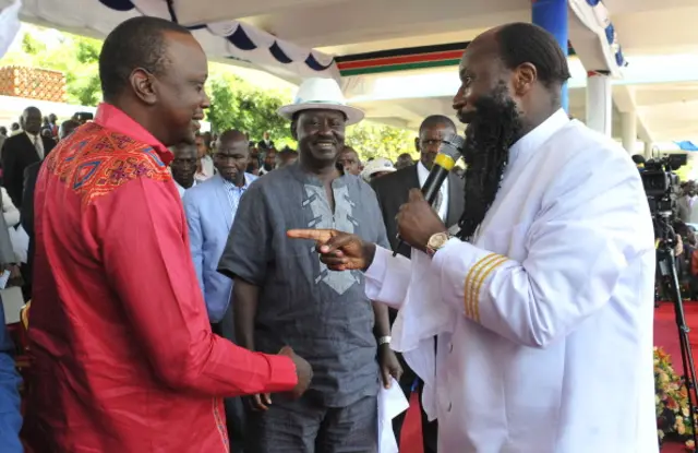 huru Kenyatta (L) and Raila Odinga (C), attend a prayer meeting on February 24, 2013 led by renowned self styled Prophet David Owuor