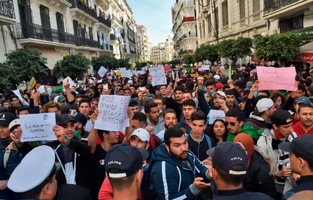 Hundreds of demonstrators viewed the behind the police line.