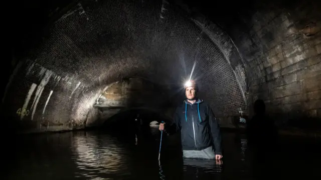 A man in the storm drain