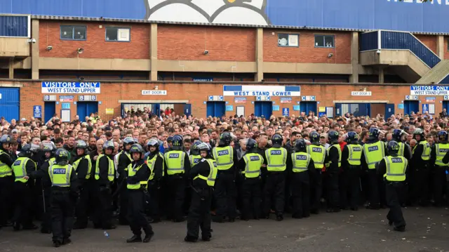 Police officers and Sheffield United fans