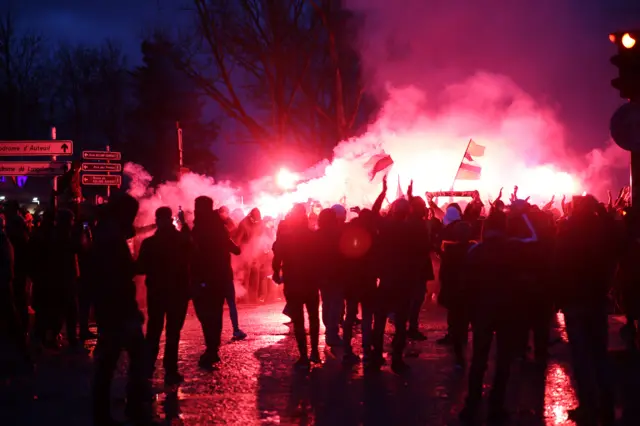 PSG Fans set off flares in the streets around the Parc des Princes