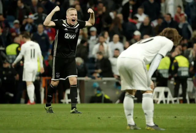 Donny Van De Beek (L) of Ajax celebrates after winning UEFA Champions League Round of 16 second leg match against Real Madrid at Santiago Bernabeu Stadium in Madrid, Spain on 5, 2019.