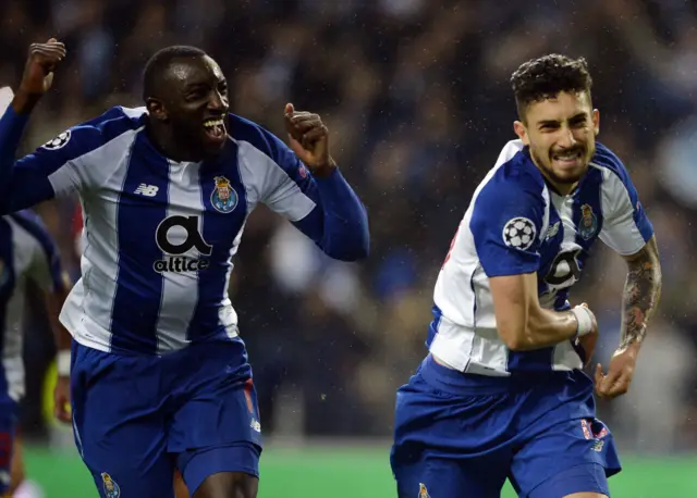 Alex Telles celebrates scoring a penalty for Porto in extra time