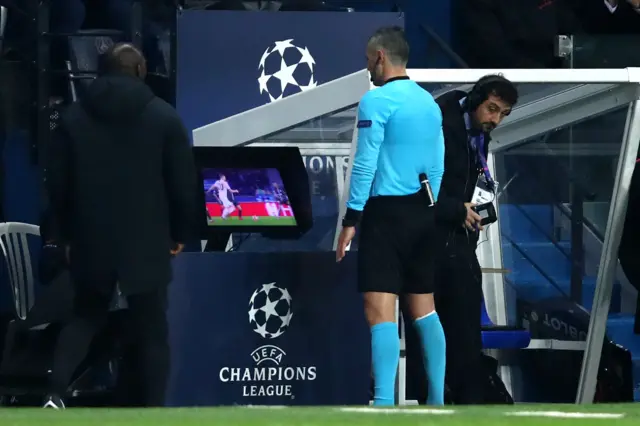 Referee assesses VAR