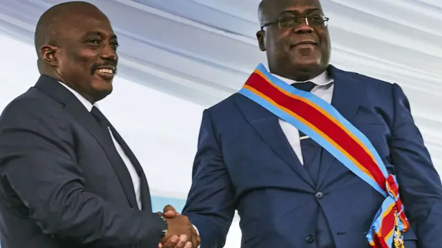 L: DR Congo's ex-President Joseph Kabila R: DR Congo's President Felix Tshisekedi - shaking hands in Kinshasa