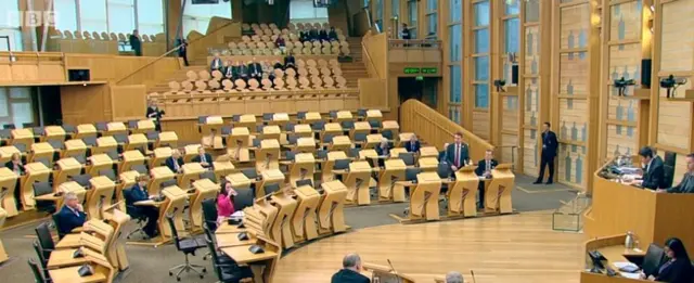 Mr Fraser standing in chamber