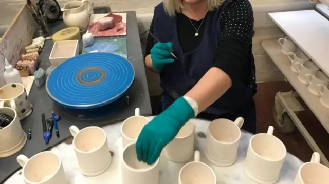 Female potter working at Emma Bridgewater