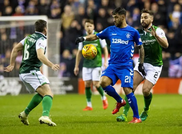 Rangers Daniel Candeias and Hibs' Darren McGregor battle for the ball