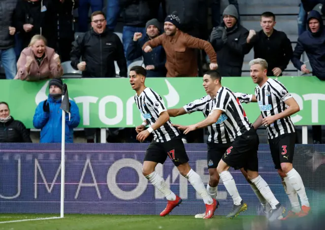 Newcastle players celebrate Ayoze Perez's second goal