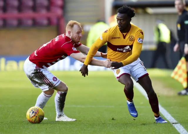 Motherwell’s Gboly Ariyibi takes on Hamilton’s Ziggy Gordon