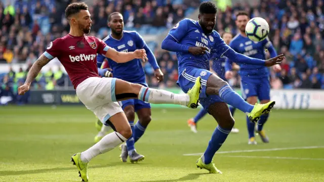 Fredericks crosses the ball