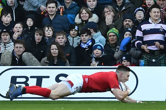 Josh Adams scores the first Welsh try