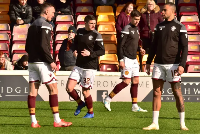 Jake Hastie (centre left) warms up ahead of Motherwell against Hamilton