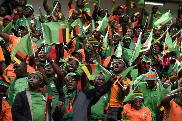 Zambian supporters cheer for their team during the FIFA World Cup 2018 qualifying football match between Nigeria and Zambia