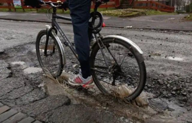 bike in pothole