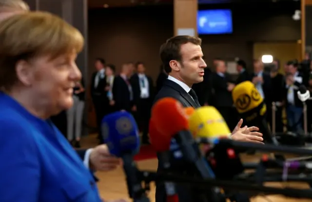 Angela Merkel and Emmanuel Macron address reporters before the summit