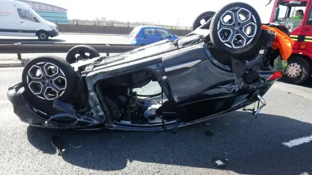 Car on roof on M6