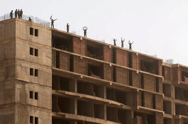 Soldiers on the roof of a building overlooking demonstration in Khartoum