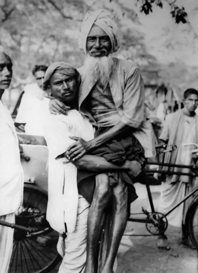 An old man is carried by a neighbour to the polling station for the election of representatives of the West Bengal Assembly on January 14, 1952, in Bhadreswar, India