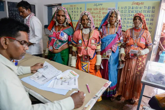 Indian lambadi tribeswomen at a polling booth in Pedda Shapur village on the outskirts of Hyderabad city.