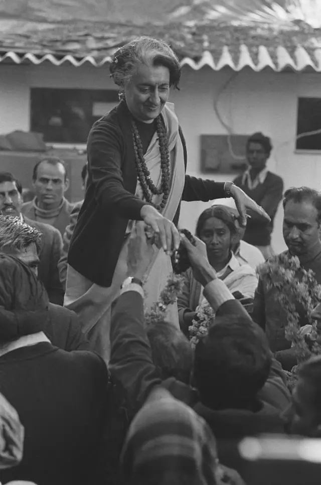 Indira Gandhi greeting her supporters.