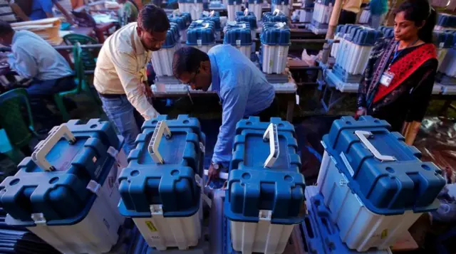 Officials check voting machines in the eastern state of West Bengal