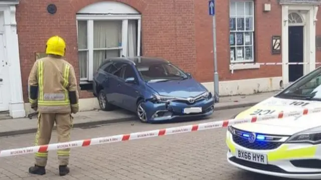 Car hits building