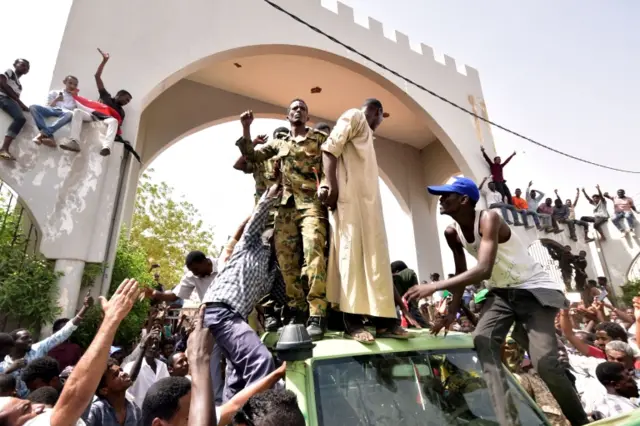 Sudanese demonstrators gather in a street in central Khartoum on April 11, 2019