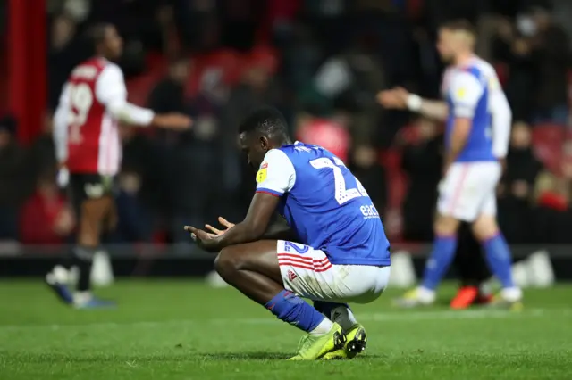 Ipswich player looks dejected