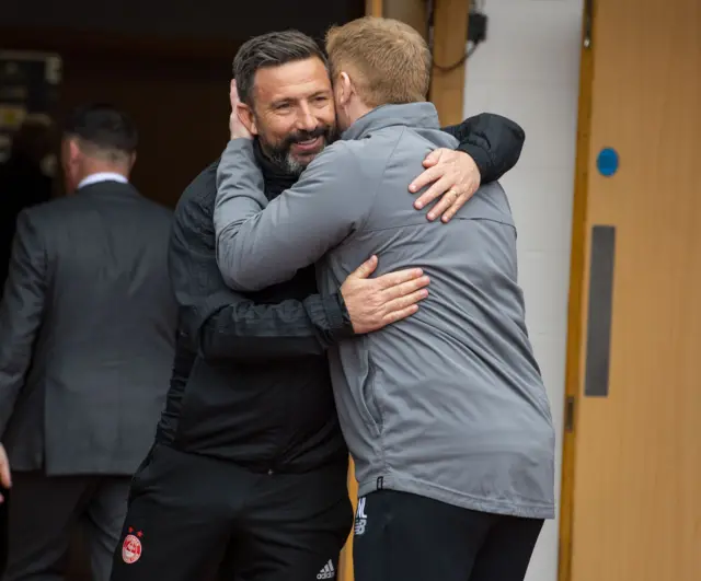 Aberdeen manager Derek McInnes and Celtic counterpart Neil Lennon embrace at Hampden