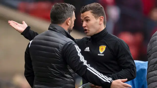 Aberdeen manager Derek McInnes speaks with the fourth official