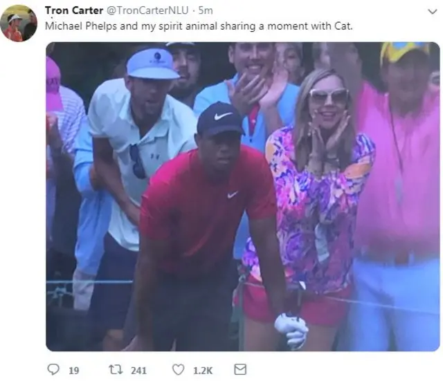 Michael Phelps following Tiger Woods