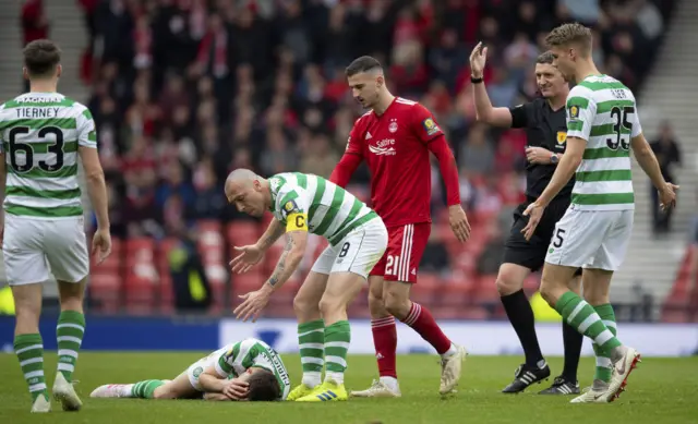 Ryan Christie lies injured at Hampden